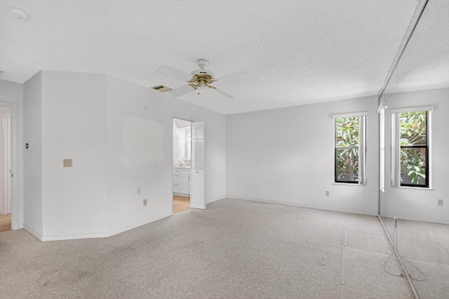 2915 NW 14th St, Delray Beach, FL 33445 - unfurnished room with light carpet, ceiling fan, a textured ceiling, and a smoke detector