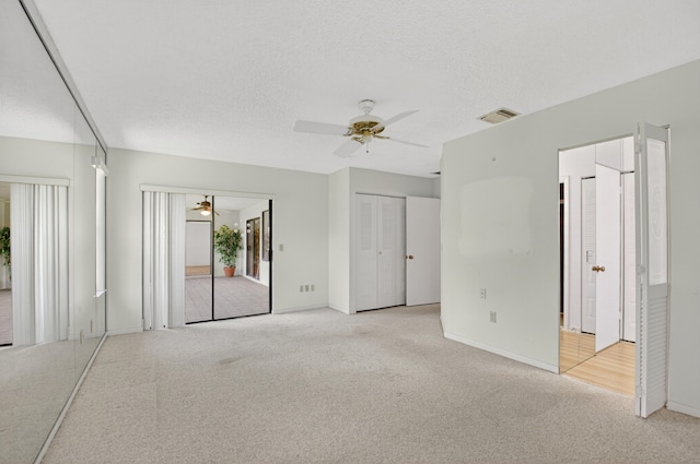 2915 NW 14th St, Delray Beach, FL 33445 - unfurnished bedroom with carpet floors, a ceiling fan, and a textured ceiling