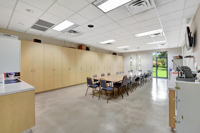 2915 NW 14th St, Delray Beach, FL 33445 - dining area with concrete flooring and a paneled ceiling