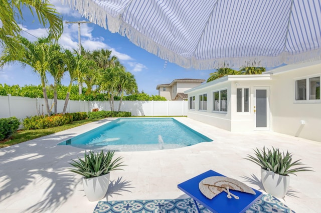 131 Cruiser Rd S, North Palm Beach, FL 33408 - view of pool featuring a fenced backyard and a patio