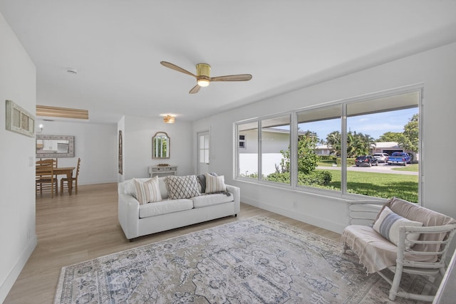 131 Cruiser Rd S, North Palm Beach, FL 33408 - living area with a ceiling fan and light wood finished floors