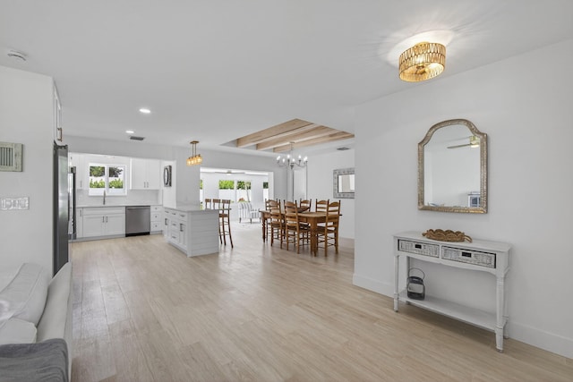 131 Cruiser Rd S, North Palm Beach, FL 33408 - kitchen featuring stainless steel appliances, white cabinets, a chandelier, light wood-type flooring, and recessed lighting