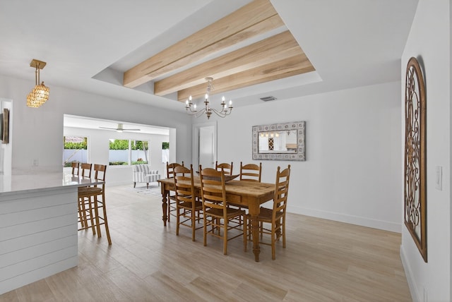 131 Cruiser Rd S, North Palm Beach, FL 33408 - dining space featuring light wood finished floors, beam ceiling, a chandelier, and a ceiling fan