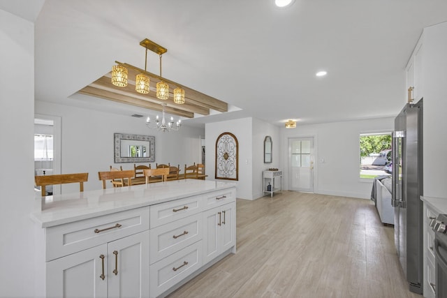 131 Cruiser Rd S, North Palm Beach, FL 33408 - kitchen with a chandelier, white cabinets, recessed lighting, light wood-style floors, and hanging light fixtures