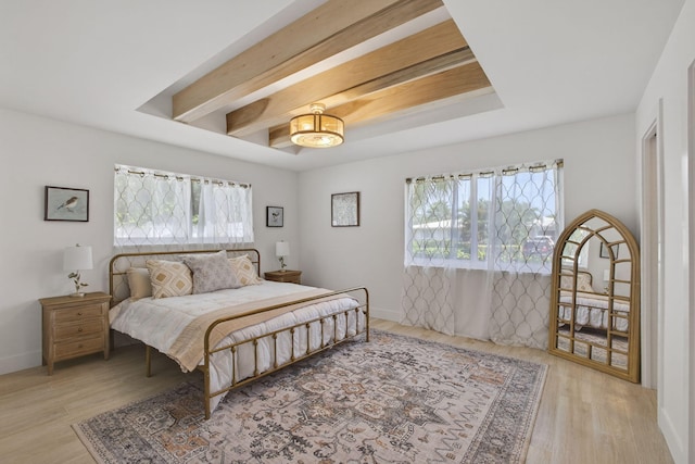 131 Cruiser Rd S, North Palm Beach, FL 33408 - bedroom with multiple windows, a chandelier, wood finished floors, and beamed ceiling