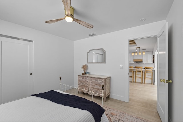 131 Cruiser Rd S, North Palm Beach, FL 33408 - bedroom featuring light wood-style floors and a ceiling fan