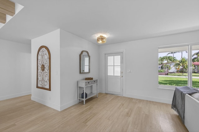131 Cruiser Rd S, North Palm Beach, FL 33408 - entrance foyer featuring light wood finished floors and baseboards