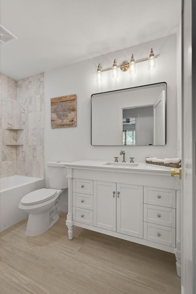 131 Cruiser Rd S, North Palm Beach, FL 33408 - full bath with vanity, shower / tub combination, and wood finished floors