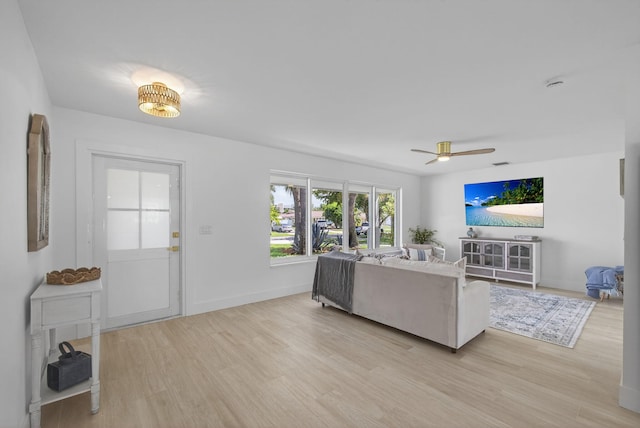 131 Cruiser Rd S, North Palm Beach, FL 33408 - living area with a ceiling fan and light wood-style flooring