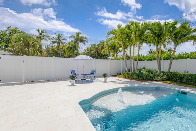 131 Cruiser Rd S, North Palm Beach, FL 33408 - view of swimming pool with a patio area and a fenced backyard