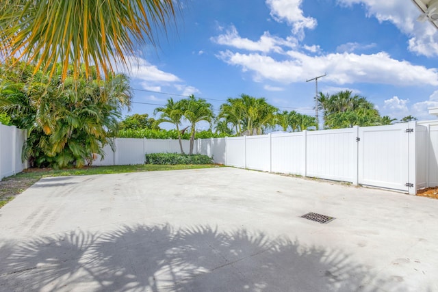 131 Cruiser Rd S, North Palm Beach, FL 33408 - fenced backyard featuring a gate and a patio area
