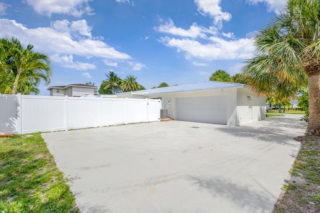 131 Cruiser Rd S, North Palm Beach, FL 33408 - garage featuring driveway