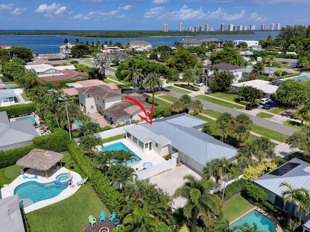 131 Cruiser Rd S, North Palm Beach, FL 33408 - aerial view of residential area featuring a pool and a large body of water