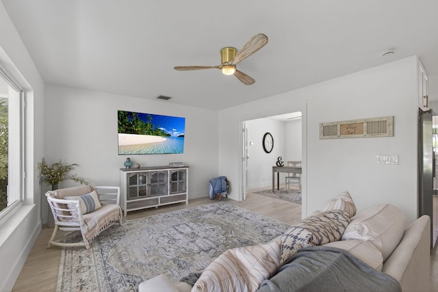 131 Cruiser Rd S, North Palm Beach, FL 33408 - living area featuring ceiling fan, light wood-style floors, and plenty of natural light