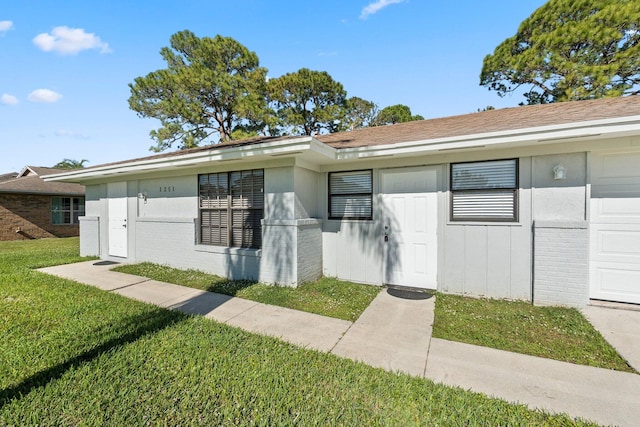 1251 SW Sudder Ave, Port Saint Lucie, FL 34953 - ranch-style house with brick siding and a front lawn