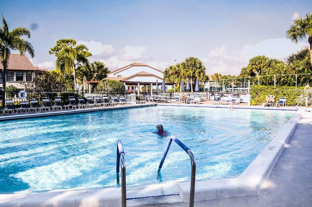 3350 Perimeter Dr Unit 1323, Greenacres, FL 33467 - community pool featuring a patio area
