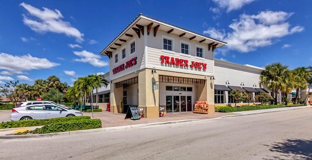 3350 Perimeter Dr Unit 1323, Greenacres, FL 33467 - view of building exterior with a garage and concrete driveway