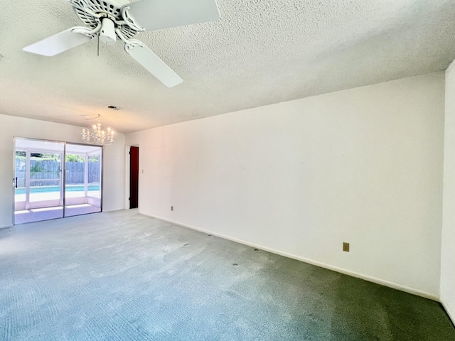 115 15th Ave, Vero Beach, FL 32962 - carpeted empty room with a chandelier, a textured ceiling, and ceiling fan