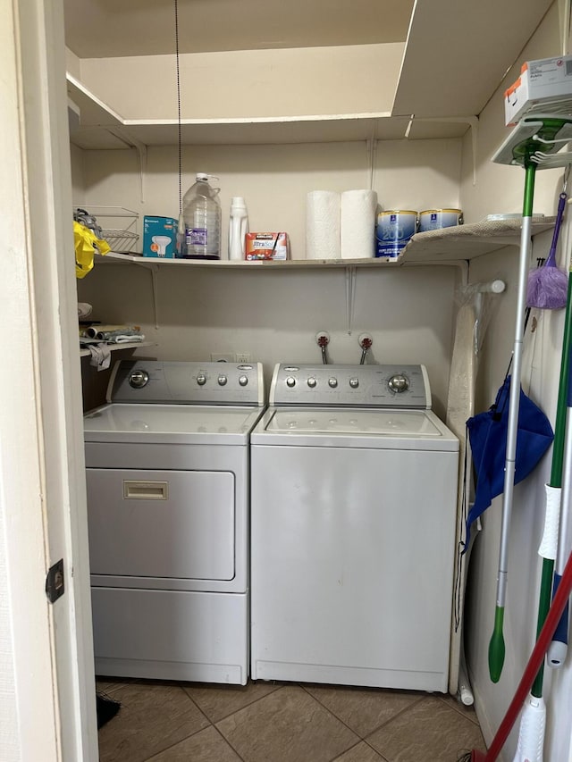 313 Normandy Unit G, Delray Beach, FL 33484 - laundry area featuring separate washer and dryer and tile patterned floors
