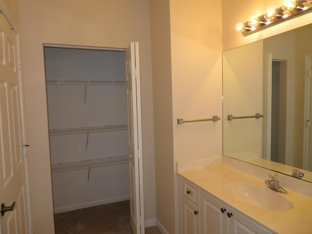 2357 Windjammer Way, West Palm Beach, FL 33411 - bathroom with vanity and a spacious closet