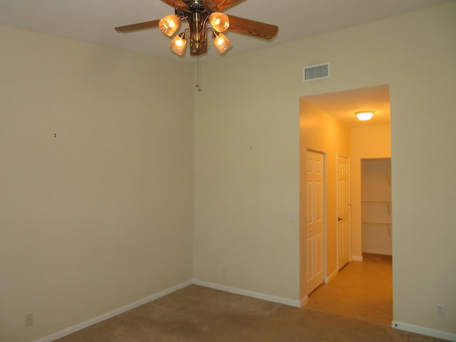 2357 Windjammer Way, West Palm Beach, FL 33411 - spare room featuring ceiling fan and carpet flooring