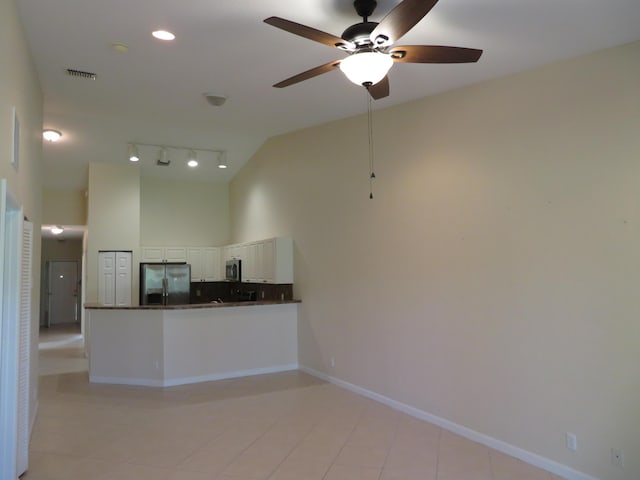 2357 Windjammer Way, West Palm Beach, FL 33411 - kitchen with appliances with stainless steel finishes, dark countertops, high vaulted ceiling, ceiling fan, and white cabinetry