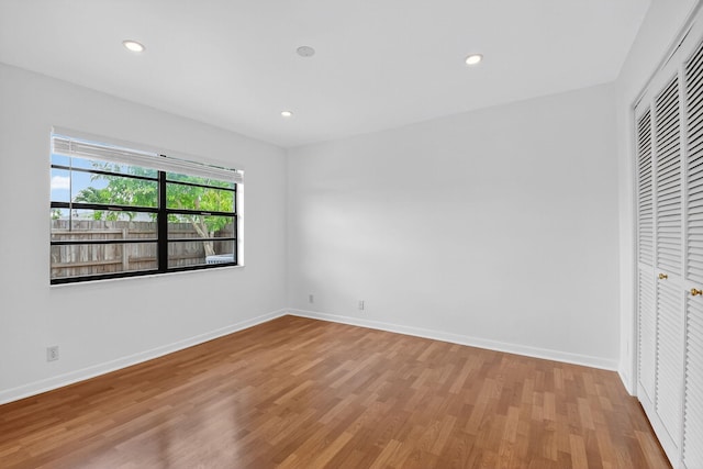 11784 Laurel Valley Cir, Wellington, FL 33414 - unfurnished bedroom with wood finished floors, a closet, and recessed lighting