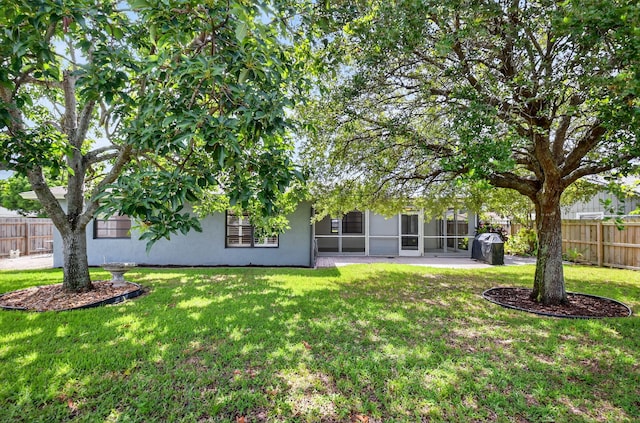 11784 Laurel Valley Cir, Wellington, FL 33414 - rear view of house with stucco siding and a sunroom