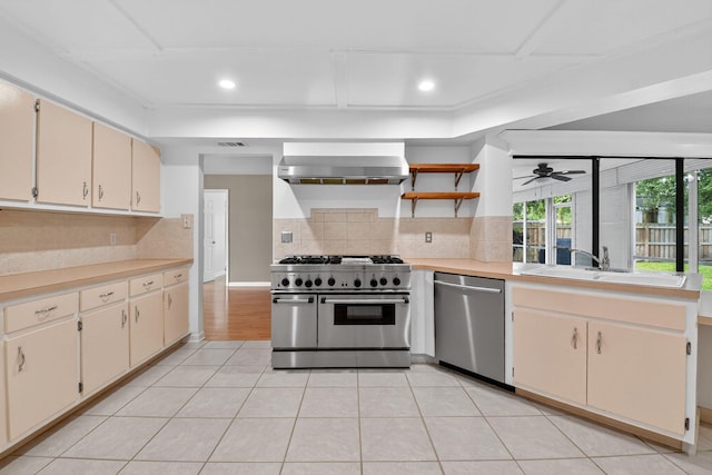 11784 Laurel Valley Cir, Wellington, FL 33414 - kitchen featuring appliances with stainless steel finishes, wall chimney range hood, light countertops, tasteful backsplash, and recessed lighting