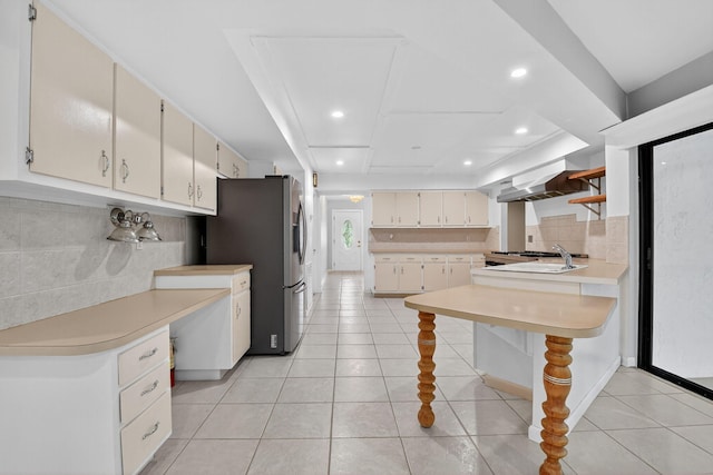 11784 Laurel Valley Cir, Wellington, FL 33414 - kitchen with open shelves, stainless steel refrigerator with ice dispenser, light countertops, backsplash, and recessed lighting