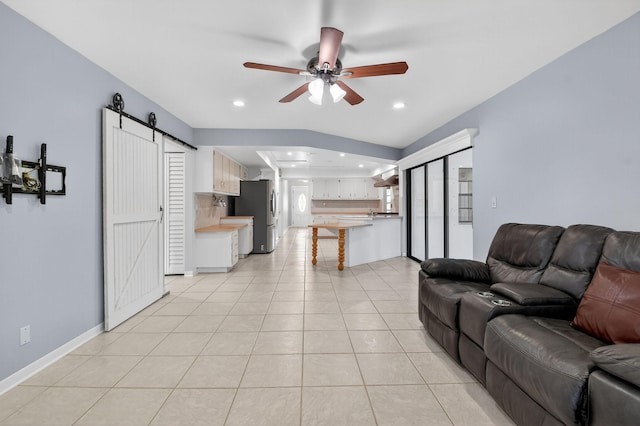 11784 Laurel Valley Cir, Wellington, FL 33414 - living room with a barn door, a ceiling fan, light tile patterned flooring, and recessed lighting