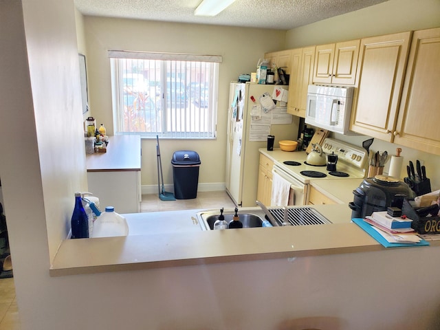 871 NW 208th Cir, Pembroke Pines, FL 33029 - kitchen featuring white appliances, light brown cabinetry, light countertops, and light tile patterned floors