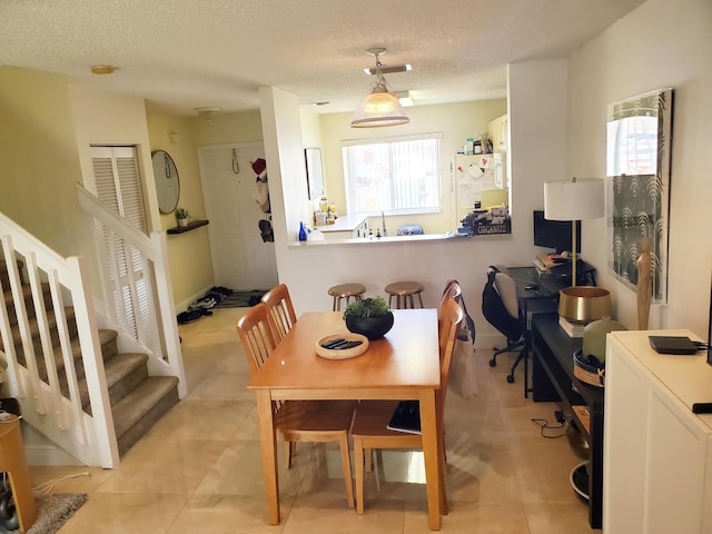 871 NW 208th Cir, Pembroke Pines, FL 33029 - dining area with a textured ceiling, stairs, and light tile patterned floors