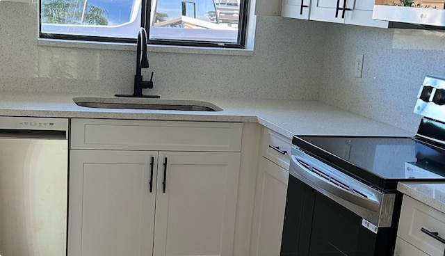 1942 SE Camilo St, Port Saint Lucie, FL 34952 - kitchen featuring electric stove, dishwashing machine, exhaust hood, tasteful backsplash, and white cabinets