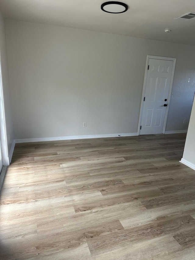 1942 SE Camilo St, Port Saint Lucie, FL 34952 - unfurnished room featuring wood finished floors and a smoke detector