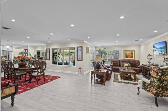 1951 SE Erwin Rd, Port Saint Lucie, FL 34952 - living room with ornamental molding, recessed lighting, healthy amount of natural light, and wood finished floors