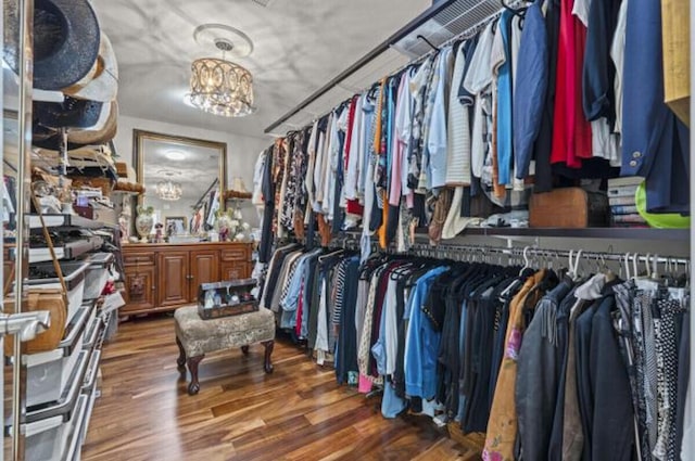 1951 SE Erwin Rd, Port Saint Lucie, FL 34952 - walk in closet featuring a chandelier and wood finished floors