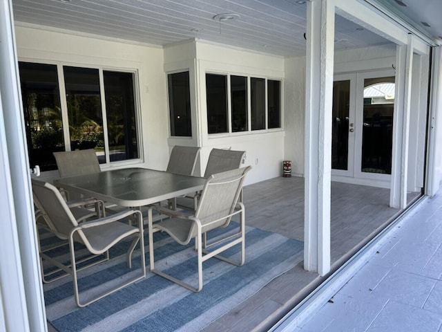 1951 SE Erwin Rd, Port Saint Lucie, FL 34952 - wooden terrace featuring french doors and outdoor dining space