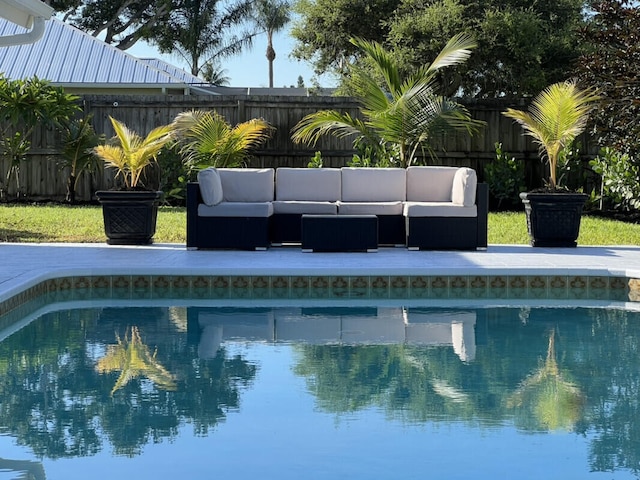 1951 SE Erwin Rd, Port Saint Lucie, FL 34952 - view of pool featuring an outdoor living space and a fenced backyard