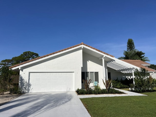 1951 SE Erwin Rd, Port Saint Lucie, FL 34952 - view of front of house featuring stucco siding, an attached garage, concrete driveway, a tiled roof, and a front yard