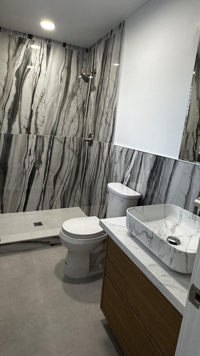 790 Sarazen Dr, West Palm Beach, FL 33413 - full bathroom featuring tile walls, a stall shower, and vanity
