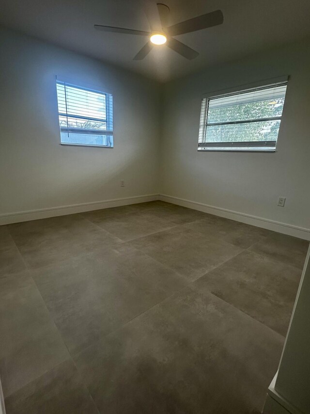 790 Sarazen Dr, West Palm Beach, FL 33413 - unfurnished room featuring baseboards and concrete floors