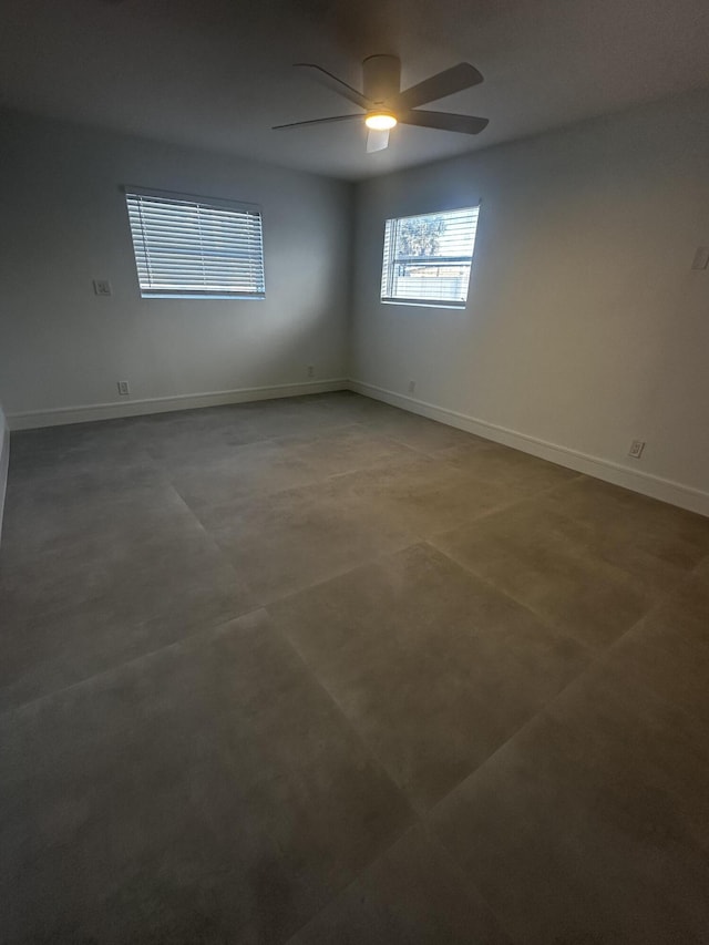790 Sarazen Dr, West Palm Beach, FL 33413 - spare room featuring a ceiling fan and concrete flooring