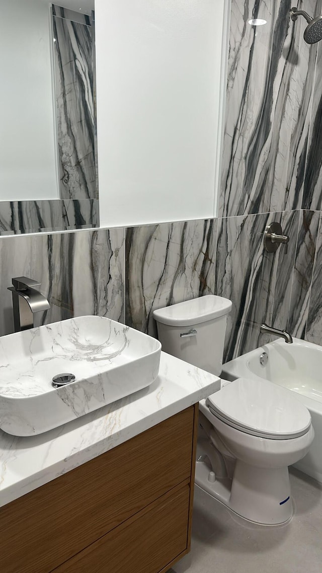 790 Sarazen Dr, West Palm Beach, FL 33413 - full bathroom featuring vanity, tile walls, and bathtub / shower combination
