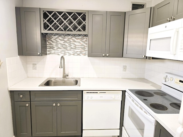 89 Saxony B B, Delray Beach, FL 33446 - kitchen featuring white appliances and gray cabinets