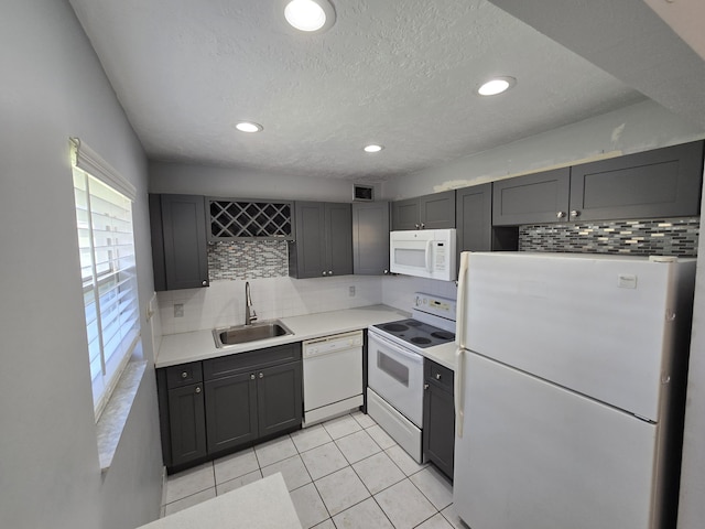 89 Saxony B B, Delray Beach, FL 33446 - kitchen with white appliances, tasteful backsplash, light tile patterned flooring, light countertops, and recessed lighting