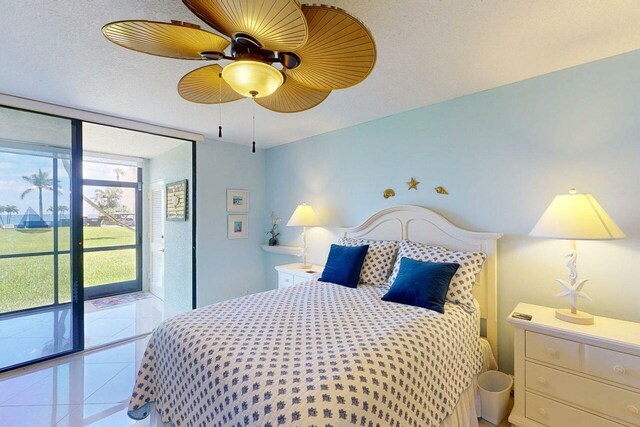 3492 NE Causeway Blvd Unit 104, Jensen Beach, FL 34957 - bedroom featuring access to outside, floor to ceiling windows, and ceiling fan