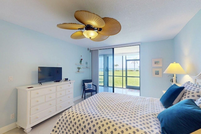 3492 NE Causeway Blvd Unit 104, Jensen Beach, FL 34957 - bedroom with access to outside and a ceiling fan