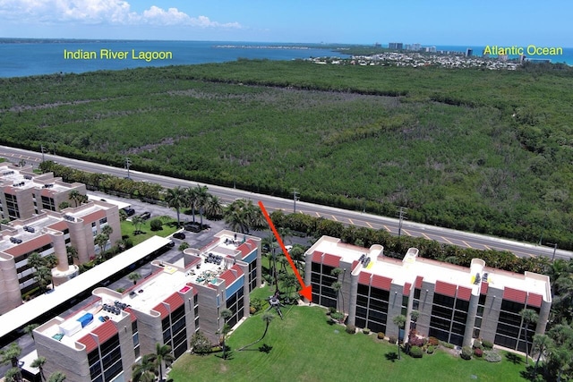 3492 NE Causeway Blvd Unit 104, Jensen Beach, FL 34957 - drone / aerial view of a nearby body of water and a forest