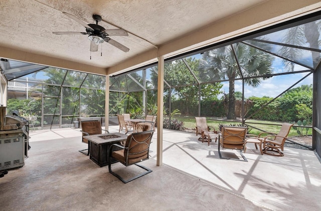 12358 Saint Simon Dr, Boca Raton, FL 33428 - view of patio with a fire pit, glass enclosure, and a ceiling fan